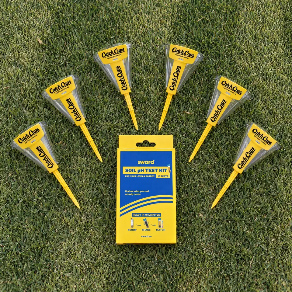 Six Catch Cups laid on a lawn in a fan around the Sward Soil pH Test Kit box, seen from above.
